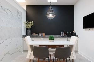 showroom photograph featuring natural stone countertop, wall accent piece